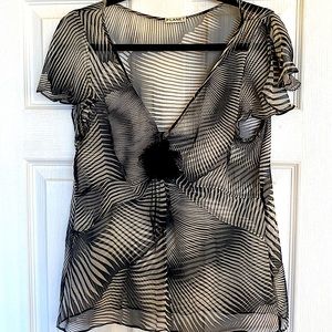 Beautiful sheer Zebra dress blouse with flower detail at v neck